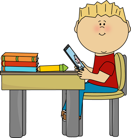 Boy Sitting at School Desk .