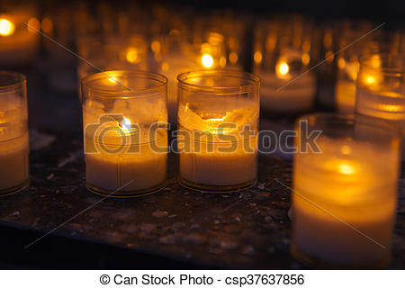 Church candles in transparent chandeliers - csp37637856