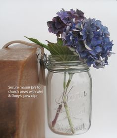 Church Pew Decoration Inspiration: Mason jar filled with fresh flowers. Ribbon, twine or lace can be added to dress plain jars.