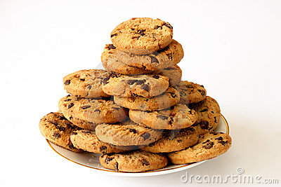 Cookies on a plate aganist a white background.