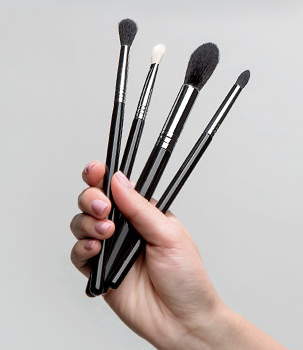 Woman holding makeup brushes ClipartLook.com 